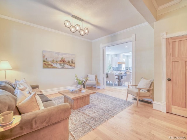 541 Fox St, Denver, CO 80204 - living room with light wood finished floors, crown molding, and a chandelier