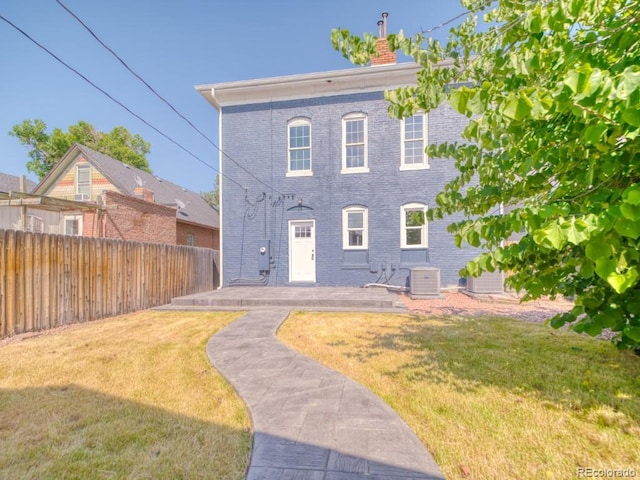 541 Fox St, Denver, CO 80204 - back of house with a chimney and brick siding