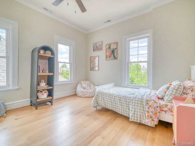 541 Fox St, Denver, CO 80204 - bedroom featuring wood finished floors, crown molding, and a ceiling fan