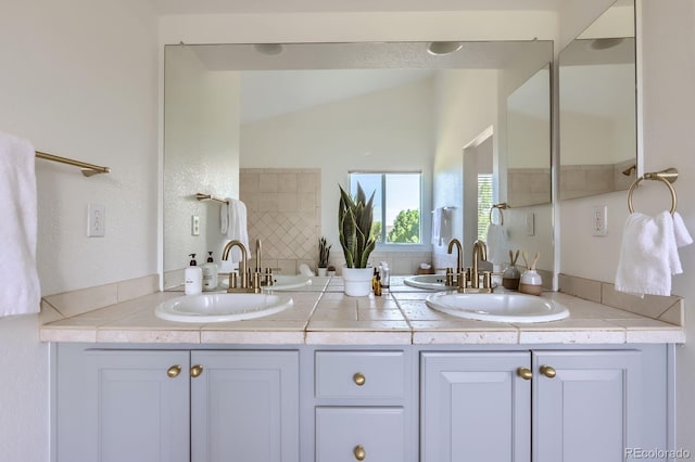 11729 Elmer Linn Dr, Longmont, CO 80504 - full bathroom featuring double vanity and vaulted ceiling