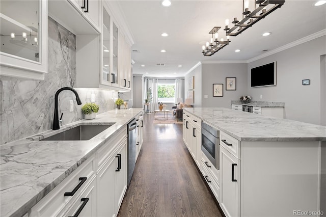 420 N Colorado Blvd, Denver, CO 80206 - kitchen with stainless steel appliances, a sink, recessed lighting, dark wood finished floors, and white cabinetry