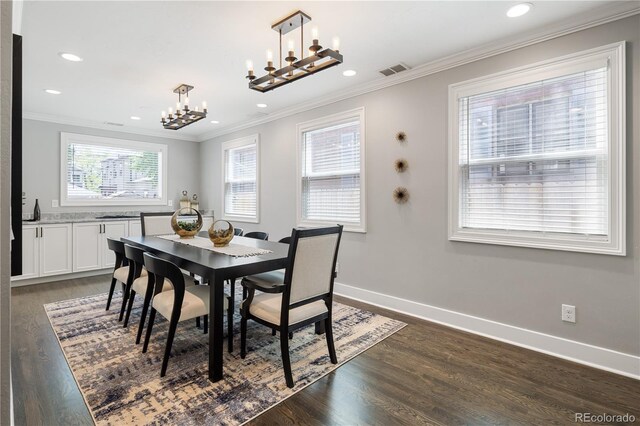 420 N Colorado Blvd, Denver, CO 80206 - dining area with a chandelier, dark wood finished floors, ornamental molding, recessed lighting, and baseboards