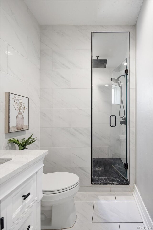 420 N Colorado Blvd, Denver, CO 80206 - full bathroom with a shower stall, toilet, vanity, and marble finish flooring