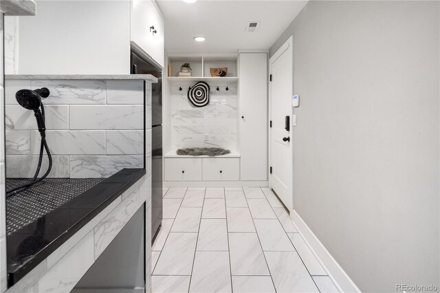 420 N Colorado Blvd, Denver, CO 80206 - washroom with light marble finish flooring, recessed lighting, and baseboards