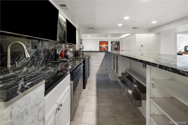 420 N Colorado Blvd, Denver, CO 80206 - kitchen with dishwasher, dark stone counters, recessed lighting, tasteful backsplash, and light tile patterned floors
