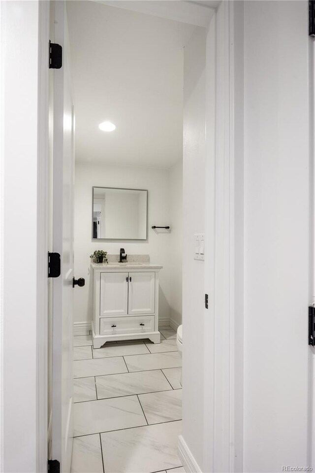420 N Colorado Blvd, Denver, CO 80206 - corridor with baseboards, light marble finish floors, and recessed lighting