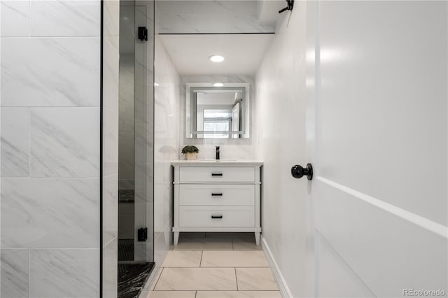 420 N Colorado Blvd, Denver, CO 80206 - bathroom with a shower stall, vanity, and marble look tiles