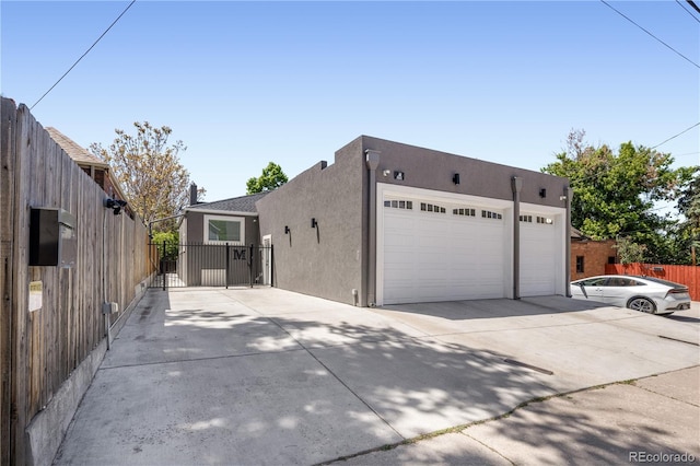 420 N Colorado Blvd, Denver, CO 80206 - view of front of house with stucco siding and driveway