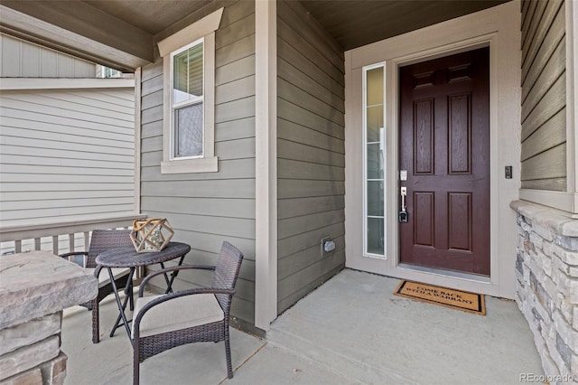 entrance to property featuring a porch