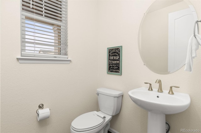 bathroom featuring toilet