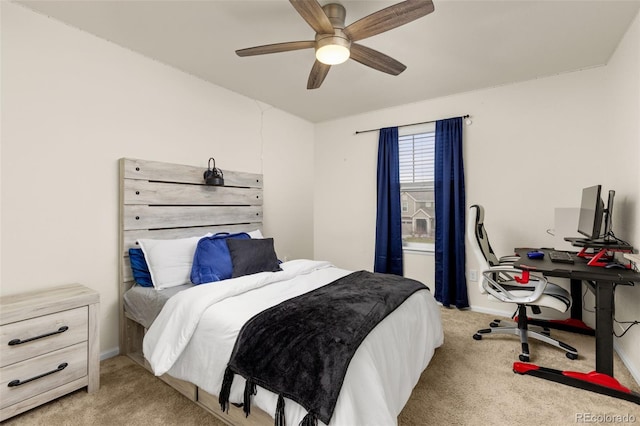 bedroom with ceiling fan and light colored carpet