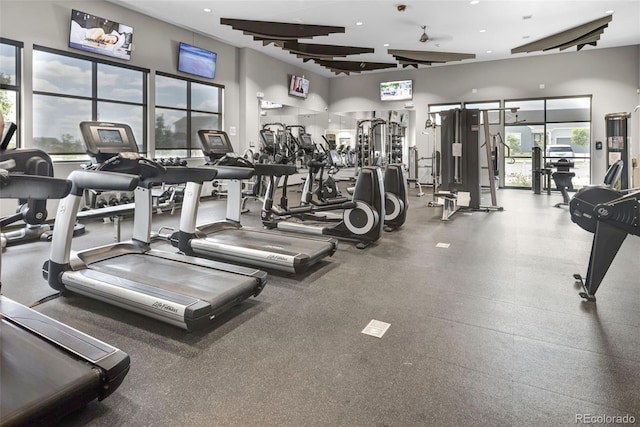 gym with a towering ceiling