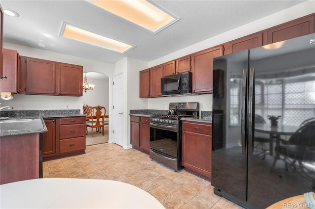 3102 White Oak Trl, Highlands Ranch, CO 80129 - kitchen featuring black appliances, a sink, arched walkways, and a chandelier