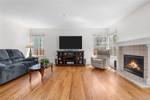 3102 White Oak Trl, Highlands Ranch, CO 80129 - living area featuring a fireplace and wood finished floors
