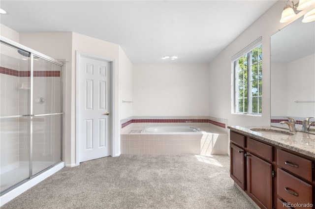 3102 White Oak Trl, Highlands Ranch, CO 80129 - bathroom featuring vanity, a tile shower, a garden tub, and carpet flooring