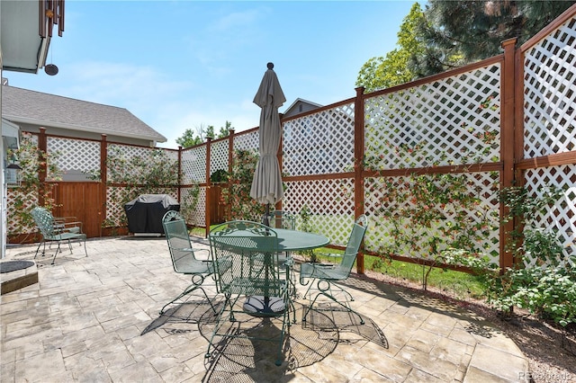 3102 White Oak Trl, Highlands Ranch, CO 80129 - view of patio featuring a grill and outdoor dining area