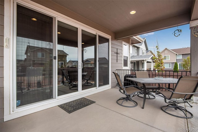 3022 Merlin Dr, Brighton, CO 80601 - view of patio with a residential view and a balcony