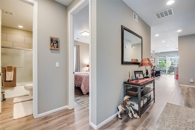3022 Merlin Dr, Brighton, CO 80601 - hallway featuring light wood-type flooring, baseboards, and recessed lighting