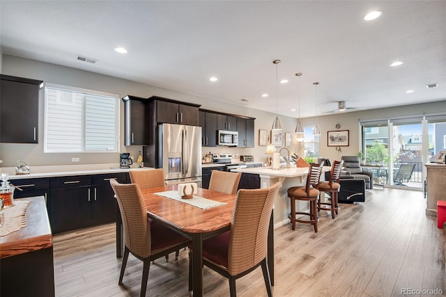 3022 Merlin Dr, Brighton, CO 80601 - dining area with recessed lighting, light wood-style floors, and a ceiling fan