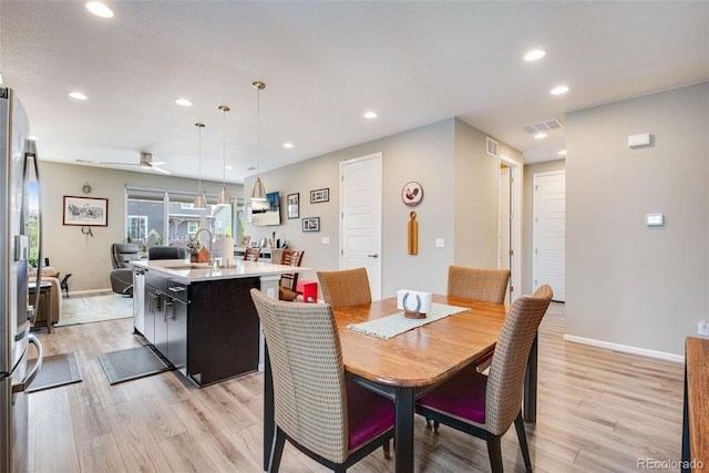3022 Merlin Dr, Brighton, CO 80601 - dining space with light wood-type flooring, recessed lighting, baseboards, and ceiling fan