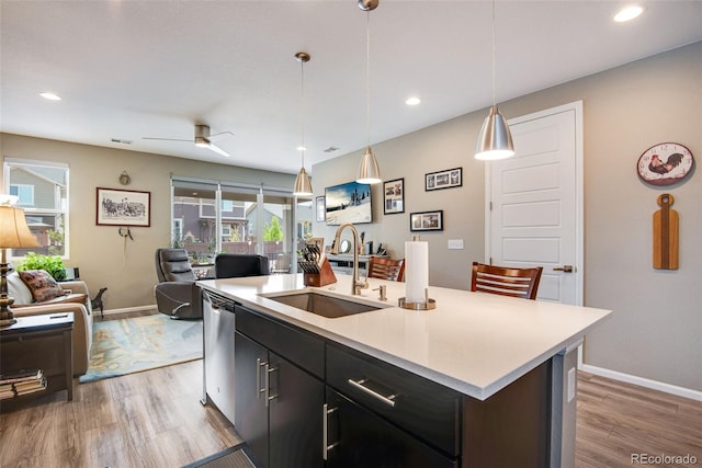 3022 Merlin Dr, Brighton, CO 80601 - kitchen with a sink, open floor plan, baseboards, healthy amount of natural light, and recessed lighting