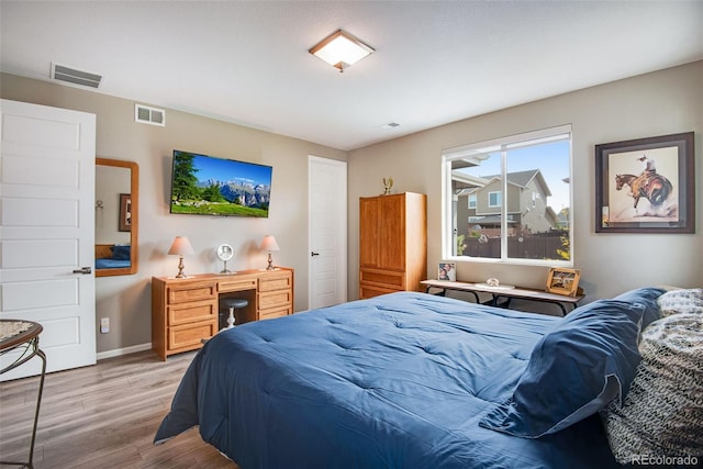 3022 Merlin Dr, Brighton, CO 80601 - bedroom featuring wood finished floors and baseboards