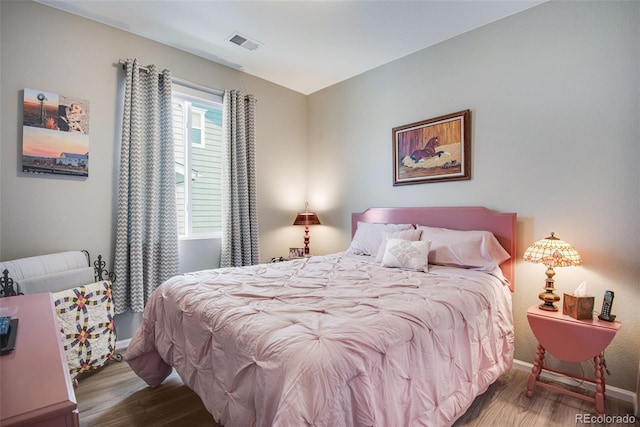 3022 Merlin Dr, Brighton, CO 80601 - bedroom with wood finished floors and baseboards