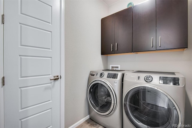 3022 Merlin Dr, Brighton, CO 80601 - laundry room featuring cabinet space, washer and dryer, light wood-type flooring, and baseboards