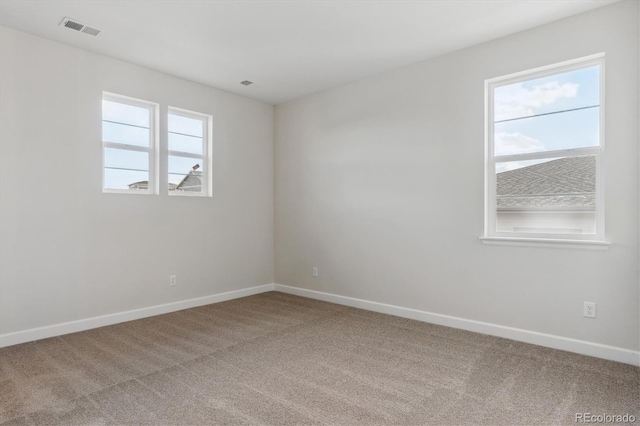 spare room featuring carpet floors