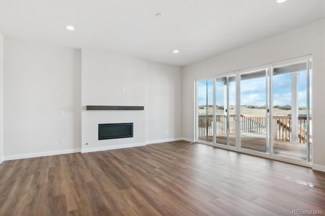 unfurnished living room with hardwood / wood-style floors