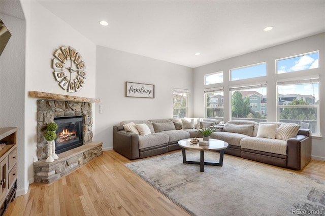 15502 E Flower Mound Pl, Parker, CO 80134 - living room with wood finished floors, a fireplace, and recessed lighting