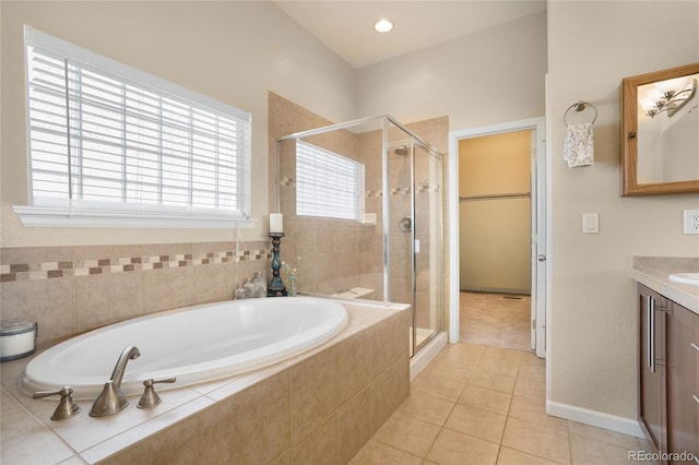 15502 E Flower Mound Pl, Parker, CO 80134 - full bath featuring vanity, a garden tub, a stall shower, and tile patterned floors
