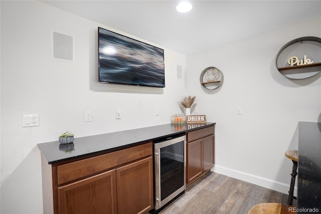 15502 E Flower Mound Pl, Parker, CO 80134 - indoor dry bar with wine cooler, wood finished floors, and recessed lighting