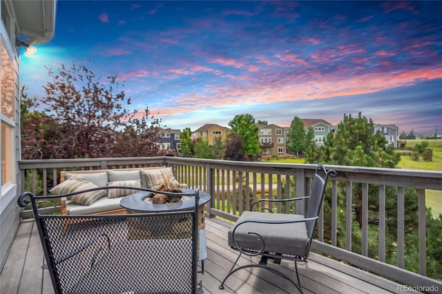 15502 E Flower Mound Pl, Parker, CO 80134 - deck at dusk with a residential view and an outdoor living space with a fire pit