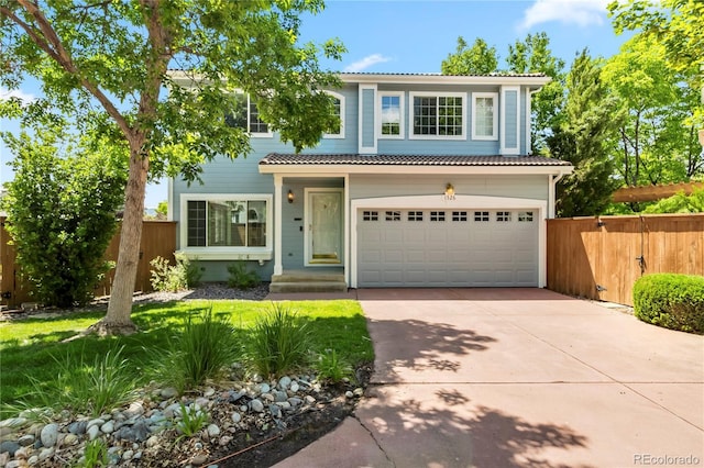 1526 Braewood Ave, Littleton, CO 80129 - view of front of house featuring driveway, a garage, and a tiled roof