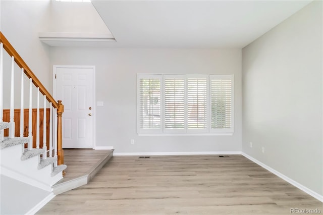 1526 Braewood Ave, Littleton, CO 80129 - foyer with light wood-style flooring, stairway, and baseboards