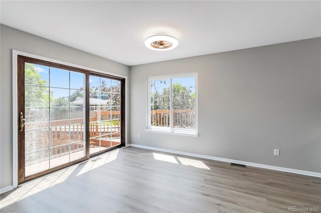 1526 Braewood Ave, Littleton, CO 80129 - spare room featuring baseboards and wood finished floors