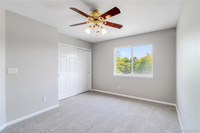 1526 Braewood Ave, Littleton, CO 80129 - unfurnished bedroom with carpet, baseboards, a closet, and a ceiling fan