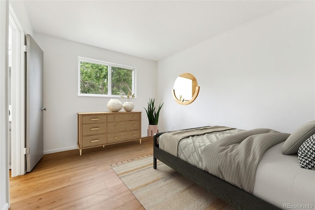 4617 S Norfolk Way, Aurora, CO 80015 - bedroom featuring light wood finished floors and baseboards