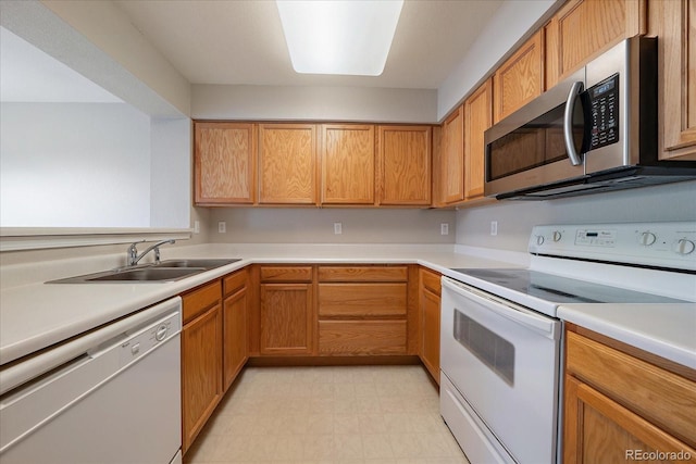 kitchen with sink and white appliances