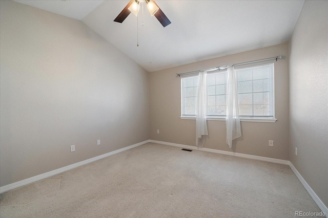 unfurnished room with ceiling fan, carpet floors, and lofted ceiling