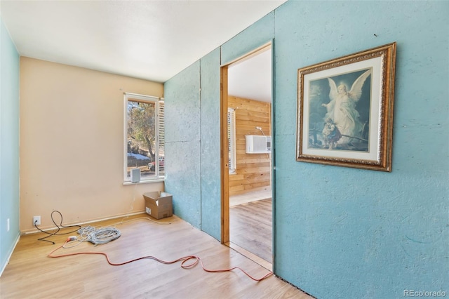 interior space featuring wood walls and hardwood / wood-style flooring