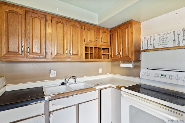 kitchen featuring electric stove and sink