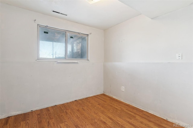 empty room featuring hardwood / wood-style flooring