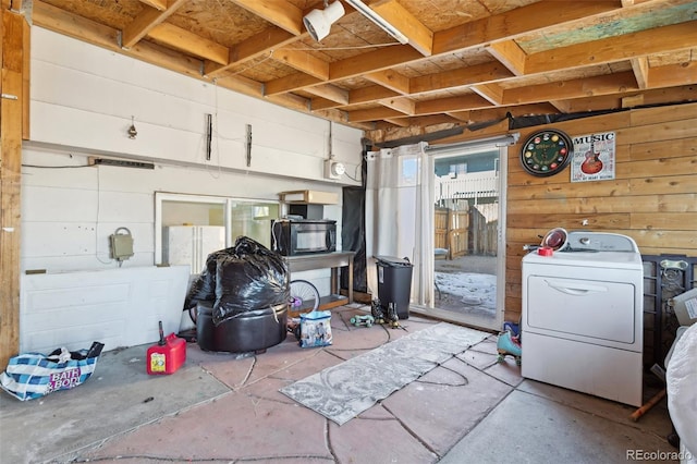 interior space featuring washer / dryer and a healthy amount of sunlight