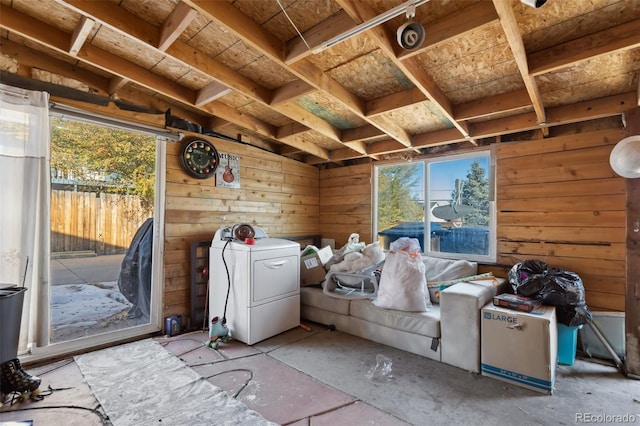 misc room with washer / clothes dryer and wooden walls