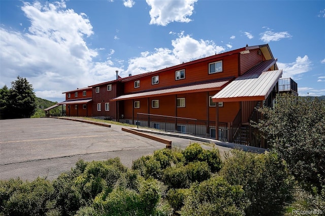 3295 Apres Ski Way Unit B9, Steamboat Springs, CO 80487 - view of building exterior with uncovered parking