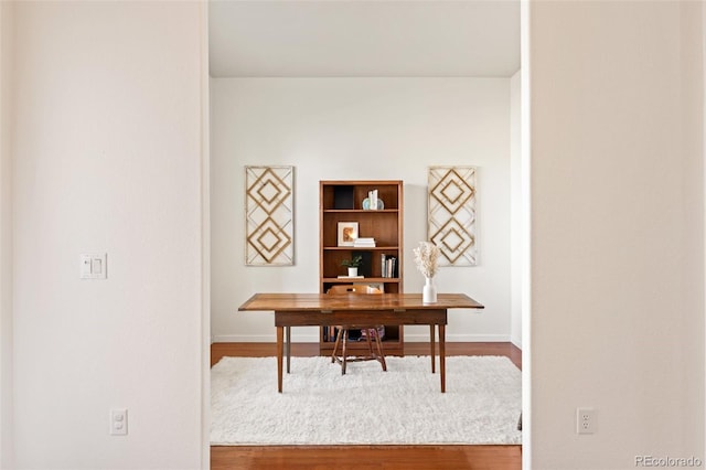 office area featuring wood finished floors and baseboards