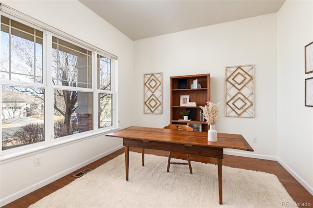 home office with dark wood-style floors, baseboards, and visible vents