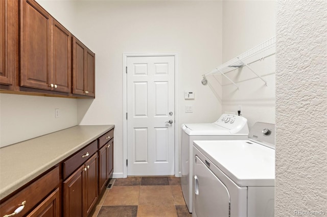 laundry room with cabinet space and washer and dryer